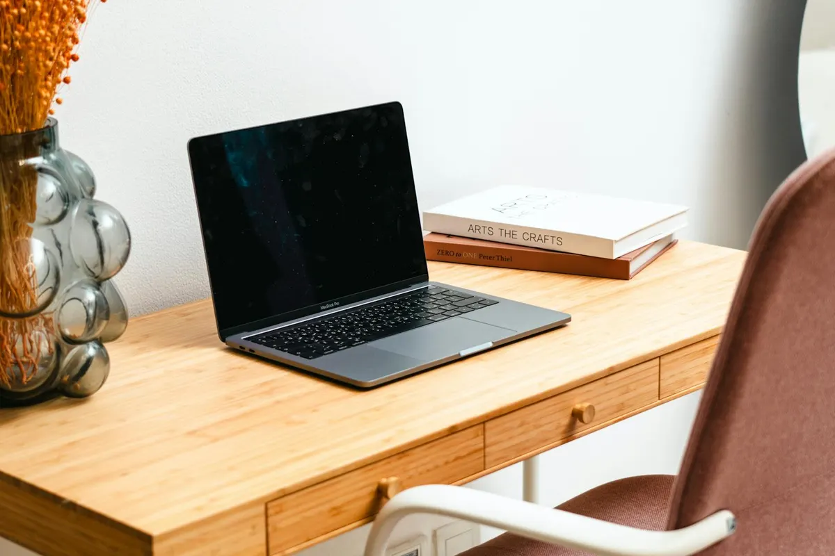 A standing desk in a sunlit home office