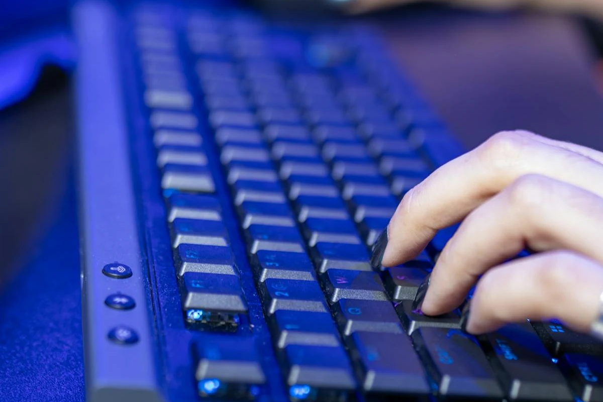 Close-up of hands typing on a keyboard